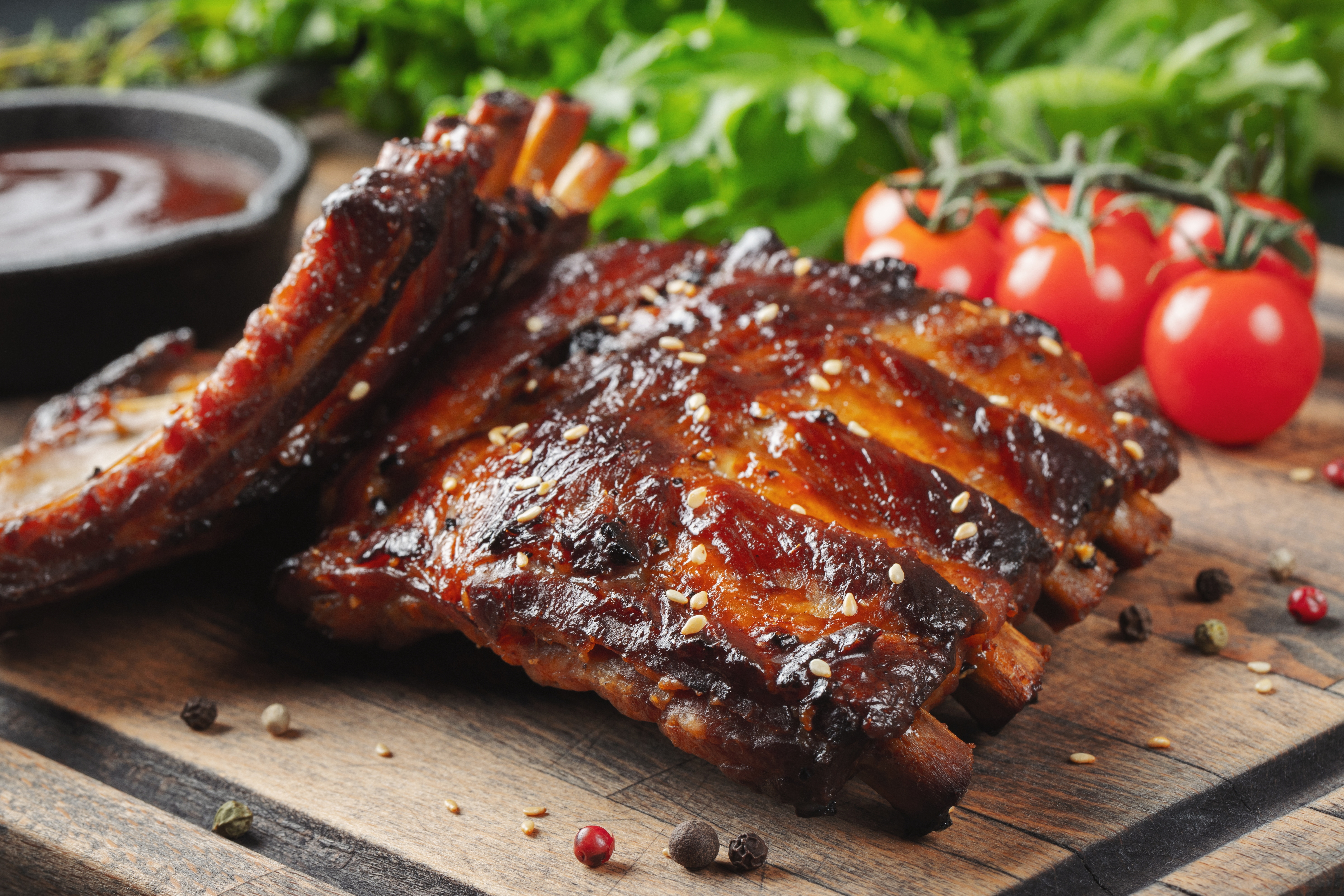 Glazed barbecue ribs on a wooden board