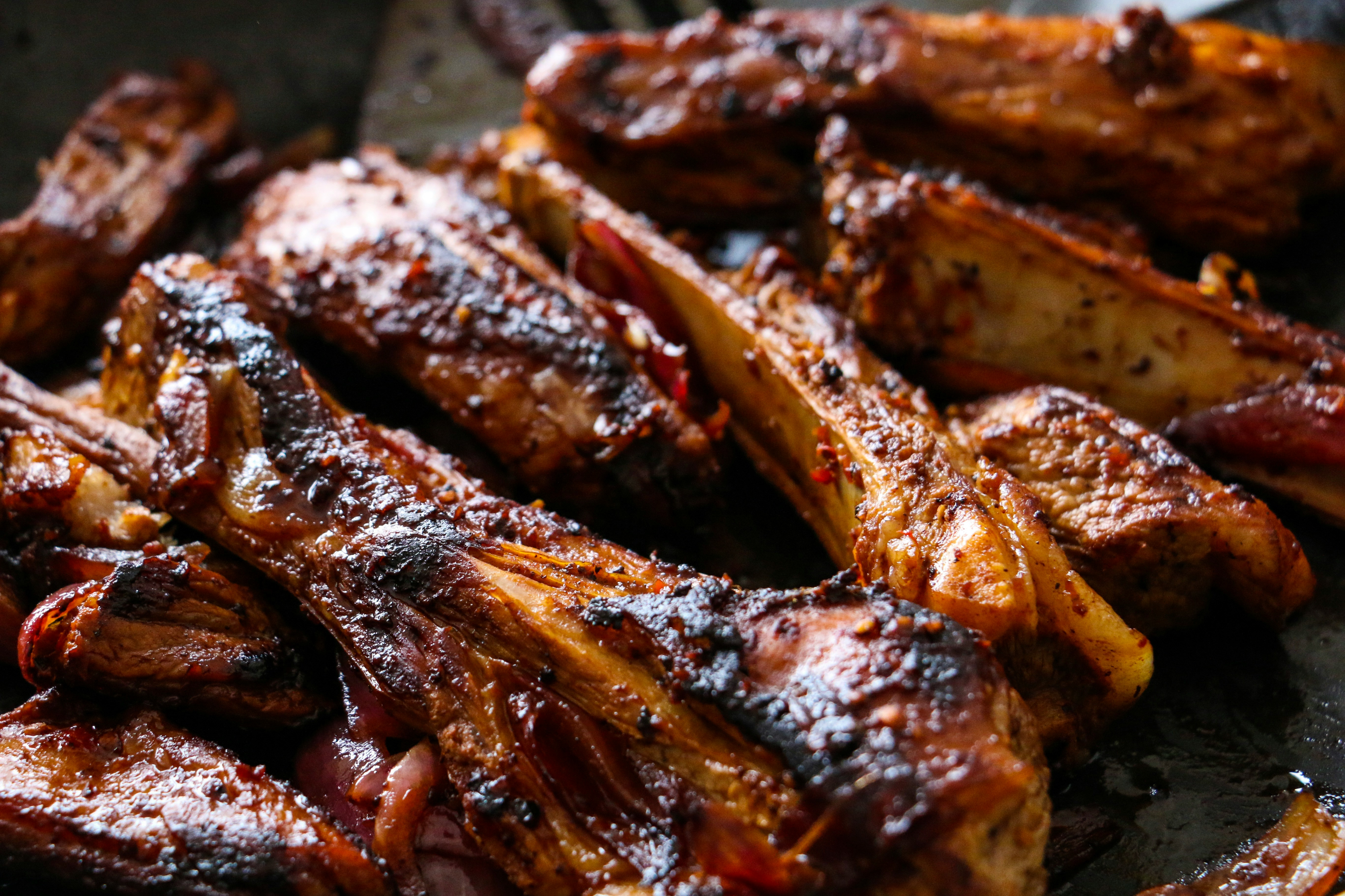 Close-up smoked ribs sliced on a cutting board