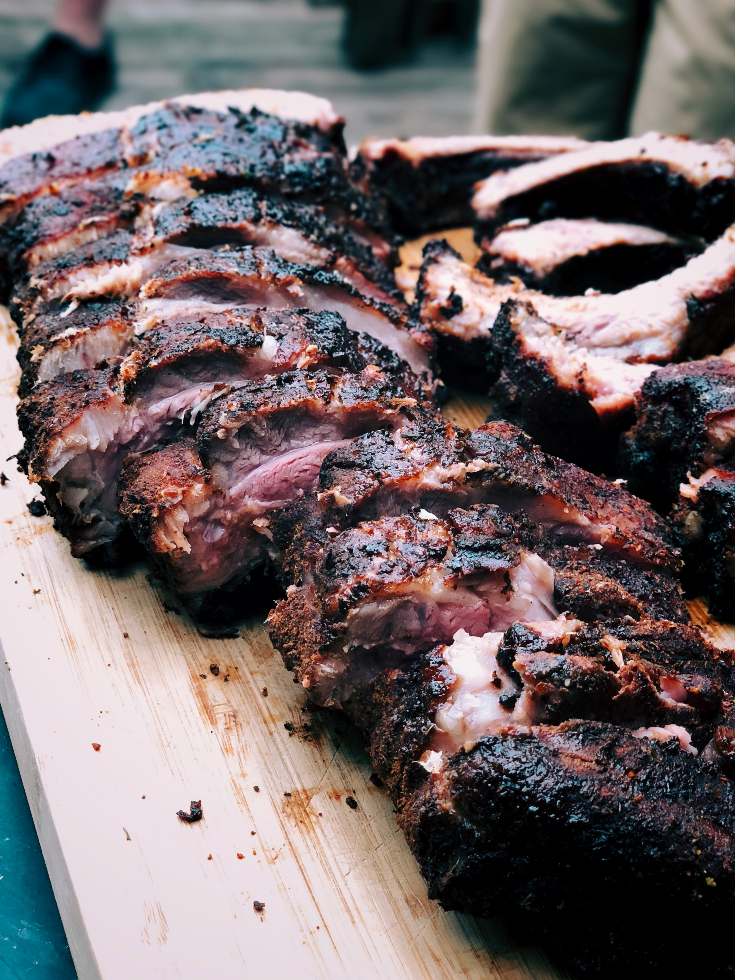 Close-up smoked ribs sliced on a board